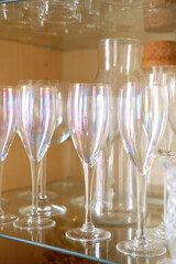 classic tainbow champagne glasses on shelf in dresser - closeup