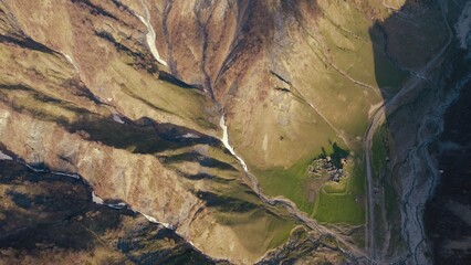 a beautiful landscape of Caucasus mountains and gorge, Georgia, Europe. ascending view. High...