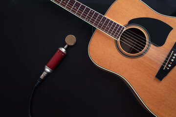 Flat lay, music background with acoustic guitar.