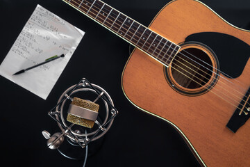 Flat lay, music background with acoustic guitar.