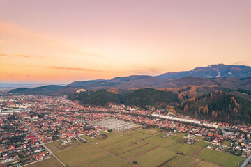 Aerial view of Rasnov, Romania shows that the buildings are styled with medieval fortress architecture. Medieval fortification in Brasov. Drone shot of Rasnov Medieval city