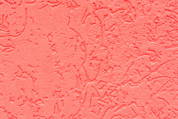 Salmon-colored background. The texture of a concrete (plastered) painted wall.