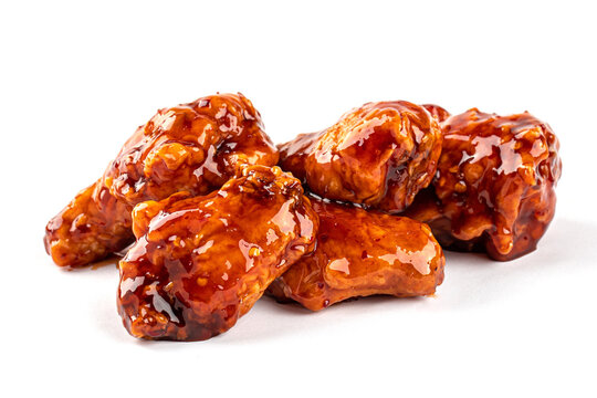Isolated fried chicken wings with sweet sauce on white background