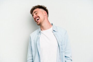 Young caucasian man isolated on white background dancing and having fun.