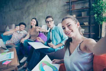 Portrait of cheerful satisfied group students take selfie prepare together exam test loft office indoors