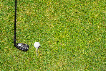 Top view of golf club on a green grass on golf course