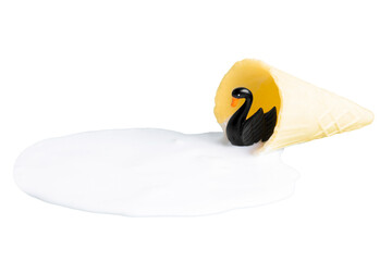Black swan figurine in ice cream puddle on white