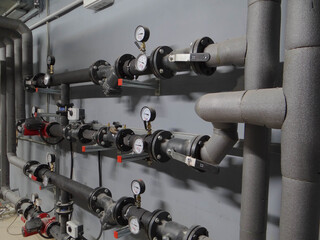 water node.pipes and fittings.water supply control unit in the heating system.steel pipes in...
