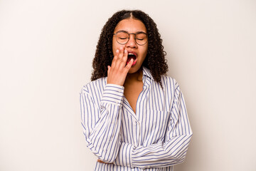 Young African American woman isolated on white background yawning showing a tired gesture covering mouth with hand.
