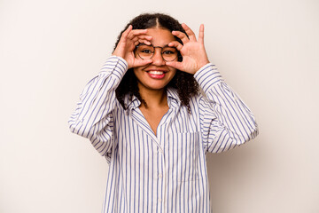 Young African American woman isolated on white background excited keeping ok gesture on eye.