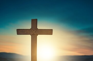 Classic wooden cross on sky background
