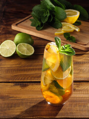 Refreshing ice tea with lemon, lime and peppermint. Copy space.