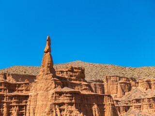 Red tales from clay. Issyk-Kul region in Kyrgyzstan. Beautiful mountain landscape. Tourism and...