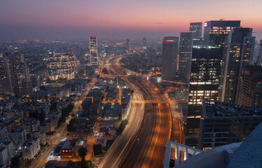 Tel Aviv city sunset aerial panorama above: Ayalon river and modern skyscrapers