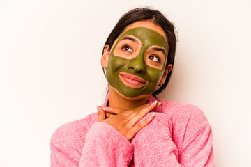 Young hispanic woman wearing facial mask isolated on white background