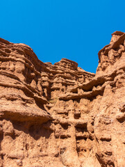 Red tales from clay. Issyk-Kul region in Kyrgyzstan. Beautiful mountain landscape. Tourism and...