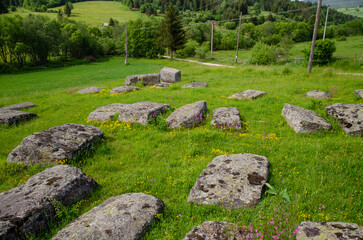 Fototapeta na wymiar The old medieval necropolis called Stecci in Central Bosnia. Medieval tombstone called Stecak near the town of Novi Travnik. Necropolis called Maculje in the heart of Bosnia and Herzegovina.