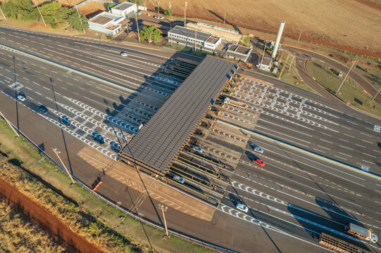 Ribeir&atilde;o Preto, S&atilde;o Paulo / Brazil - Circa June 2022: Highway toll plaza and speed limit with aerial image, view of automatic payment lanes, non-stop.