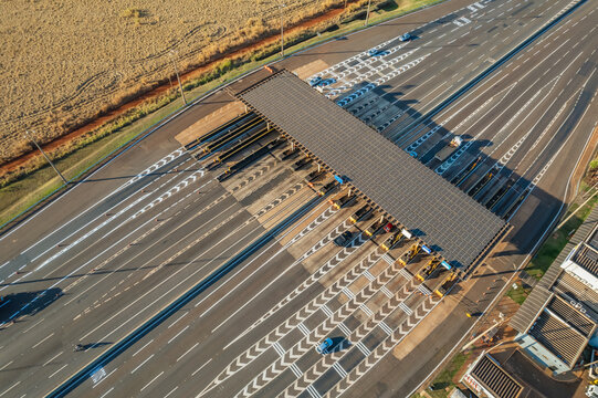 Ribeir&atilde;o Preto, S&atilde;o Paulo / Brazil - Circa June 2022: Highway toll plaza and speed limit with aerial image, view of automatic payment lanes, non-stop.