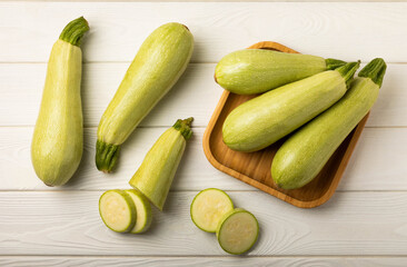 Fresh organic zucchini on a white wooden table.Vegan food.Healthy vegan food. Fresh organic product.Vegetables. Healthy food.Copy space.