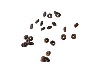 Chocolate rings cereal spill out into a bowl. Breakfast.