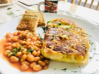 Breakfast ; cheesy potato with beans