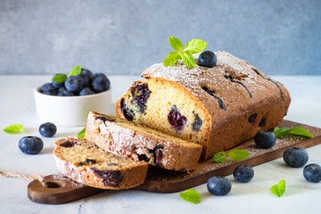 Blueberry cake on white background. Homemade sweet baking.