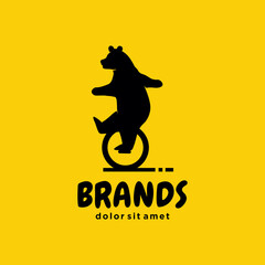 Circus Bear on one wheel bike logo design on a yellow background. illustration of Bear Riding a Unicycle  © blueberry 99d