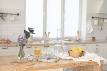 Making a refreshing summer drink. Preparing lemonade in the kitchen. Healthy food concept