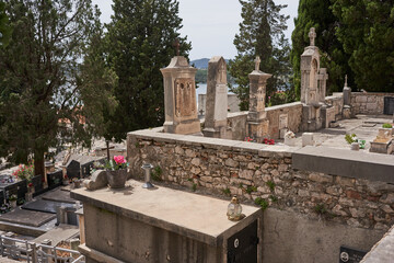 Sibenik, Croatia - May 26, 2022 - the Saint Ana's Cemetery on a sunny spring afternoon