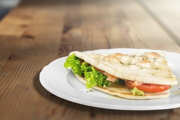 Pressed and toasted sandwich with tomato, mozzarella and basil. Delicious breakfast or snack, Clean eating, dieting, vegan food concept.