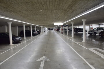 Valencia, Spain - 11 november 2019: Empty underground parking under the building of Modern Architecture in the City of Arts and Sciences, long exposure night shot.