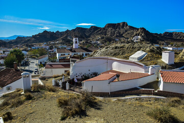 Guadix, Spain - 09 november 2019: View from the hill to Guadix, is famous for its cave houses. These cave houses are up in the hills and are in the Troglodyte Quarter (Barrio Troglodyte) of the city