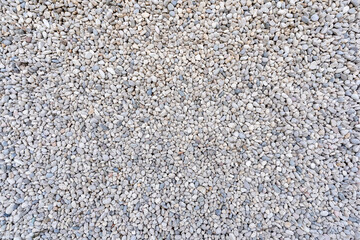 Lots of tiny stones on the ground, background texture
