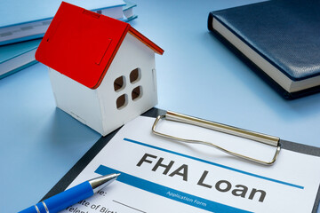FHA loan application and model of home.