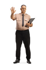 Full length portrait of a serious security officer gesturing stop with hand