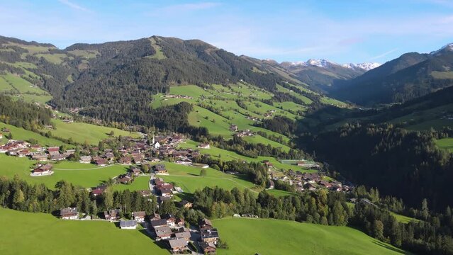 Aerial shot of the village Alpbach surrounded by beautiful mountain landscape