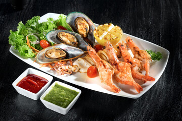 close  up view of nice yummy sea food  on dark back
