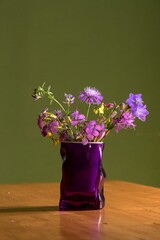 Pretty bouquet of colorful flowers in a glass jar