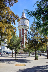 Fototapeta na wymiar Barcelona, Spain - 3 October 2019: Stylish tiled famous water tower (Torre de les Aigues) from the harbour district of Barcelona.