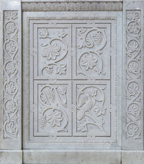 Marble stone carving with geometric, plant and bird motifs. Handmade. marble texture. Byzantine motifs in the decoration of Orthodox churches.
