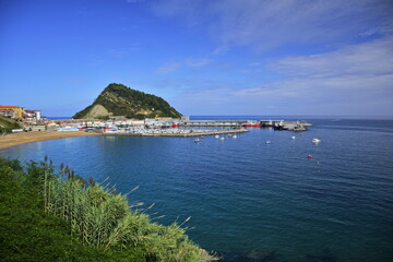 Fototapeta premium View of the ocean and a small port. The Northern Way of St. James, Spain