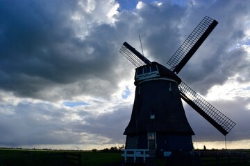 Fototapeta na wymiar dutch windmill at sunset
