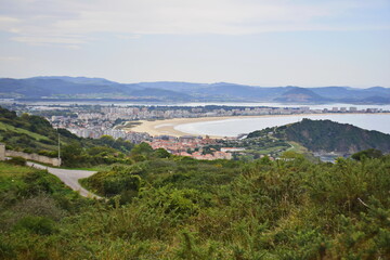 View from the hill to the city and the beach. The Way of St. James, Northern Route, Spain