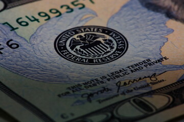 Closeup macro image of US 20 dollar bill and the Federal  Reserve symbol - obrazy, fototapety, plakaty