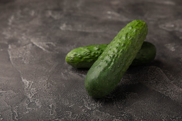 Fresh organic cucumbers on black background.Fresh vegetables.Vegan food.Healthy food.Fresh organic vegetable.Copy space.