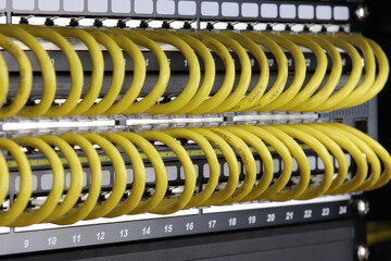 Connecting patch cords to Ethernet switches in a rack for data centers.