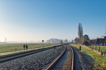 Railroad tracks with switch, warning lights and railway crossing in Warffum, province of Groningen, Netherlands
