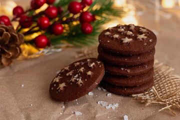 Stack of christmas chocolate chip cookies with stars and salt