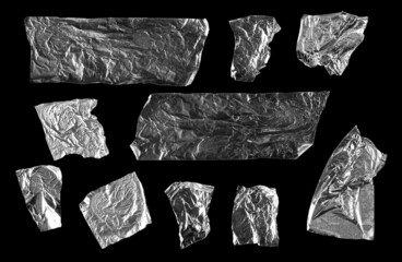 Aluminum foil tape pieces set and collection isolated on black background with clipping path, top...